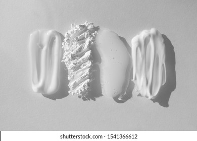 Smears Of Different Beauty Product. Moisturizer Cream, Translucent Loose Powder, Soap, Facial Mask And Cleanser Isolated On White Background. Beauty And Face, Hand And Body Skin Care Concept