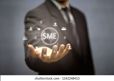 SME,SMEs (or Small And Medium Enterprises), Along With Personal Network Icons And Hand-held Shopping.