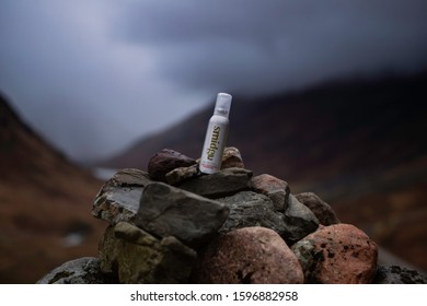 Smidge Insect Repellent. Glencoe, Highlands, Lochaber, Scotland. 12/21/2019. Spray can of Smidge sat on Rocks with blurred background.