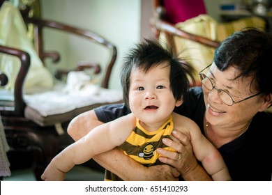 Smile Asian Baby With His Grandma 