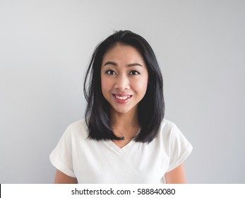 Smile Asian Woman Straight Face Portrait In White T-shirt.