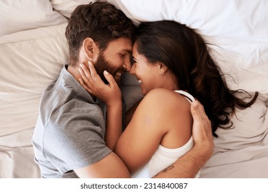 Smile, bed and happy couple hug, relax and spending lazy morning together, bonding and intimacy on Spain vacation. Happiness, marriage and top view of romantic man, woman or people embrace in bedroom - Powered by Shutterstock