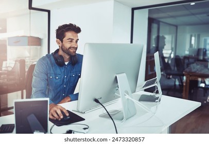 Smile, computer and business man in office for planning, reading email or network online in creative startup. Pc, programmer and coding software for information technology, internet or cyber security - Powered by Shutterstock