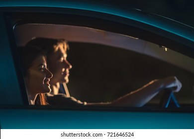 The Smile Couple Drive A Car. Evening Night Time