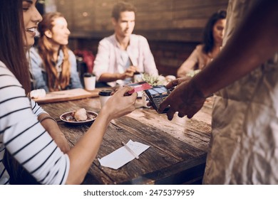 Smile, credit card and woman at cafe for payment or transaction on pos machine. Waiter, friends and debit at restaurant service with customer group together for finance and banking at coffee shop - Powered by Shutterstock