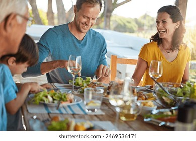 Smile, eating and family in backyard for food, celebration and happy bonding together at table. Children, parents and grandparents with laughing, drinks and lunch on patio for outdoor holiday fun - Powered by Shutterstock