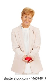 Smile Elderly Woman Holding Heart Model