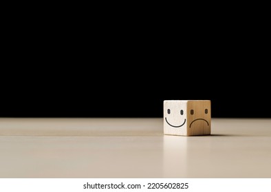 Smile Face On The Bright Side And Sad Face In Dark Side On The Wooden Block Cube For Positive Mindset Selection. Mental Health And Emotional State Concept, Choice Satisfaction Feedback Emotional.