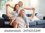 Smile, family and portrait on shoulder by sofa for weekend fun, happiness and bonding together. Playful, mom and dad with daughter in living room for support, care and love at home on fathers day