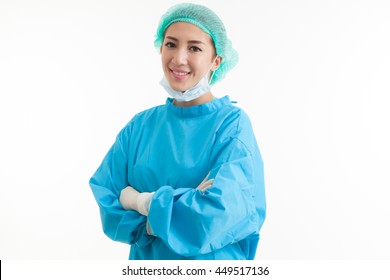 Smile female nurse or surgeon wearing a sterile blue suit or gown waiting on the operation theater isolated on white