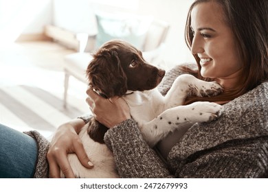 Smile, happy and woman with dog on sofa bonding with pet in living room at apartment. Relaxing, animal and female person cuddle, hug and embrace puppy with love and care on couch in lounge at home. - Powered by Shutterstock