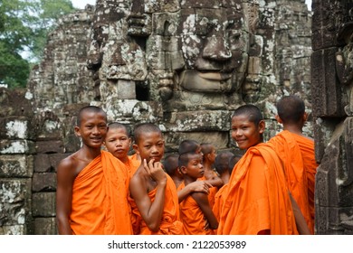 The Smile Of Khmer, The Representative Of Angkor Wat, Meets A Group Of Young Monks. Looking Back And Smiling In The Same Frame As The Buddha's Smile         