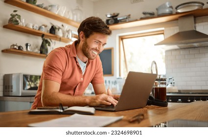 Smile, laptop and remote work, happy man at kitchen counter with app for email, social media or networking for online job. Technology, communication and freelancer on internet writing blog or article - Powered by Shutterstock