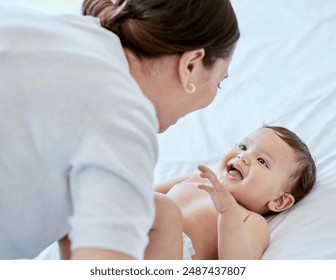 Smile, mom and baby on bed with playing, bonding and laughing together with happy toddler. Home, mother and infant girl relax in bedroom with fun for growth, love and support in child development - Powered by Shutterstock