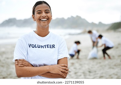 Smile, portrait and volunteer woman at beach for cleaning, recycling and sustainability. Earth day, laughing and proud female with arms crossed for community service, charity and climate change. - Powered by Shutterstock