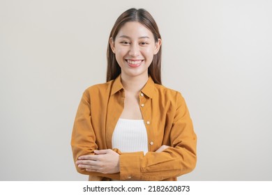 Smile Positive, Attractive Asian Young Woman Wearing Casual, Portrait Of Beautiful Brunette Her With Long Hair, Feeling Happy Looking At Camera, Standing Cross Arms Chest Isolated On White Background.