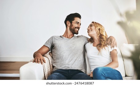 Smile, relax and couple on sofa in home with hug, love and care for bonding together. Happy, marriage and young woman and man embracing for support and connection in living room at house in Canada. - Powered by Shutterstock