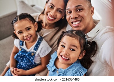 Smile, selfie and portrait of a happy family that love enjoy quality time, relaxing and bonding together in a house. Mother, father and girl children siblings smiling for pictures at home in Lisbon - Shutterstock ID 2216364485