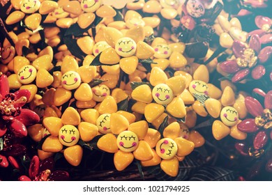 smile shape candies, yellow and red treats look like flowers