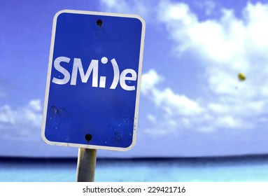Smile sign with a beach on background