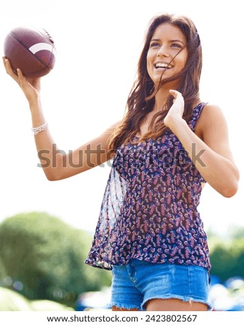 Smile, sports and woman throwing football outdoor on field for fitness, recreation or fun in summer. Sky, camping and adventure with happy young person playing catch in nature, forest or woods