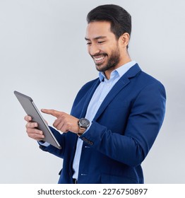 Smile, tablet and asian businessman in studio reading email, networking and internet on white background. Connect, online report and man in suit, communication and technology for investor at startup. - Powered by Shutterstock