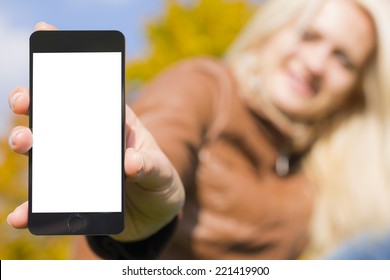 smile woman holding smartphone in hand autumn