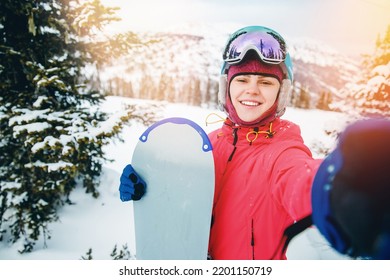 Smile Woman Sportsman Snowboarder Make Selfie Photo On Action Camera. Travel Sunset Sheregesh, Kemerovo Region Russia.