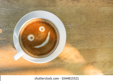 Smiley Coffee Latte Art, On Wood Table.