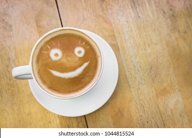 Smiley Coffee Latte Art, On Wood Table.