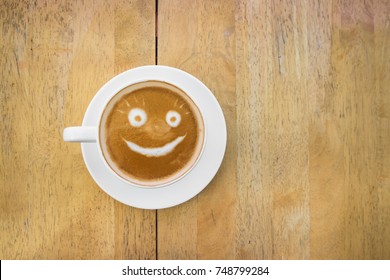 Smiley Coffee Latte Art, On Wood Table.