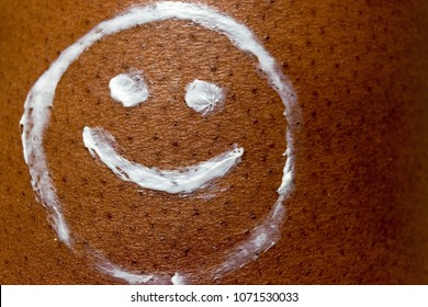 Smiley Face Drawn With Sun Cream Or Sunscreen Lotion On Dark Brown African American Skin Texture For Summer Skin Care And Health Concept.