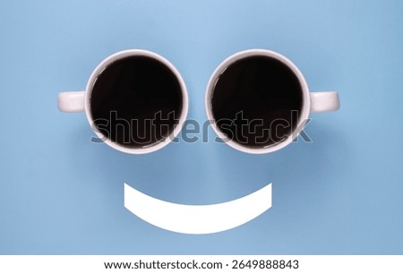 Smiley face emoticon using two cups of coffee, coffee makes you happy concept