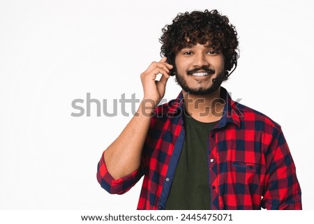 Smiley Hindi young dispatcher in headset isolated over white background. Indian IT-support manager hotline worker consulting clients customers portrait
