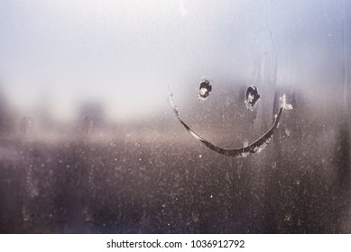 smiley on the frosty window
