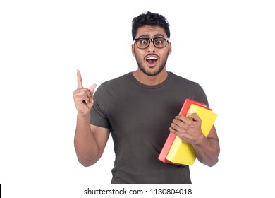 Smiley Student Holding Books Pointing Up With One Finger Got An Idea Isolated On White Background.