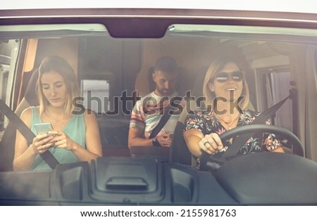 Similar – young women enjoying vacation in the car on road trip