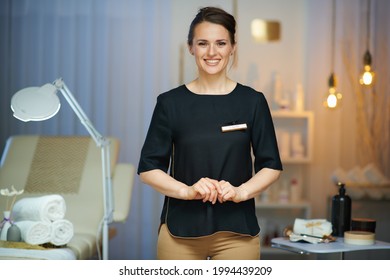 smiling 40 years old woman worker in modern beauty salon. - Shutterstock ID 1994439209