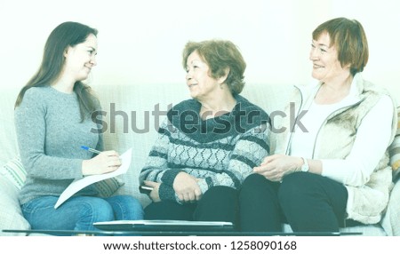 Similar – Female doctor talking to elderly patient in wheelchair