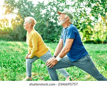 Smiling active senior people stretching and exercising together in the park, healthy lifestile workout fitness training class - Powered by Shutterstock