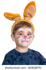 smiling adorable kid with paintings on his face and ears on
