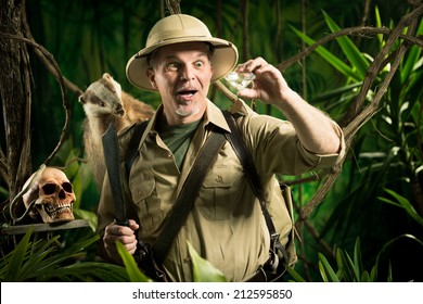 Smiling Adventurer Finding A Huge Diamond In The Jungle With Explorer Equipment.