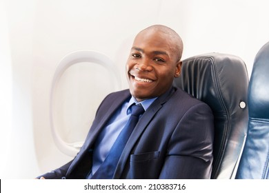 Smiling African American Airplane Passenger Relaxing During Flight