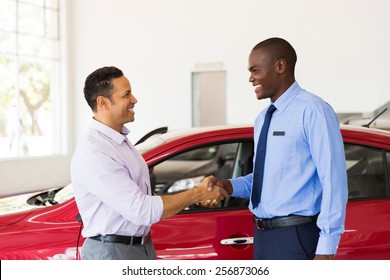 Smiling African American Car Dealer Handshake With Customer