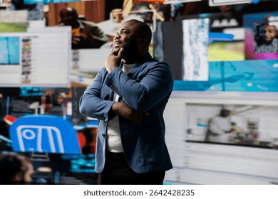 Smiling african american influencer being connected on vibrant digital interfaces and visualizations, representing mobile content creation, global reach and social network web experiences.
