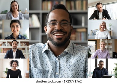 Smiling african American male employee talk speak on video call with multiracial work colleagues, diverse businesspeople coworkers have online webcam conference on computer, engaged in web briefing