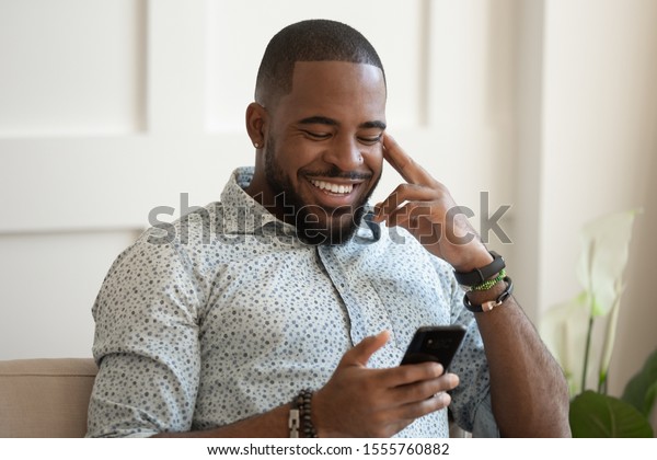 Smiling African American Millennial Man Sit Stock Photo 1555760882 ...