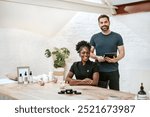 A smiling African American woman and a man in a wellness spa. Spa people in minimal modern wellness spa room reservation. Front desk reservation for spa with a man and a woman. Wellness concept.