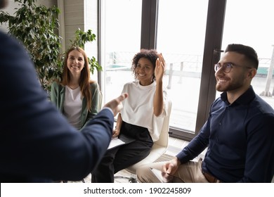 Smiling African American Woman Raising Hand, Asking Question To Mentor At Meeting Close Up, Mentor Coach Communicating With Employee At Briefing, Group Negotiations Or Job Interview In Office