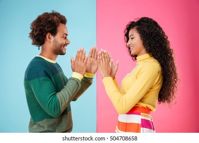 Smiling African American Young Couple Playing Patty Cake